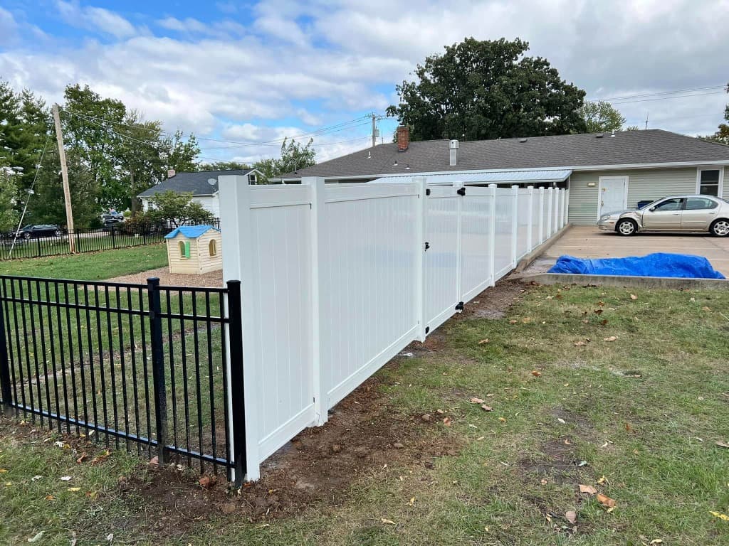workers installing fence panels workers installing fence panels